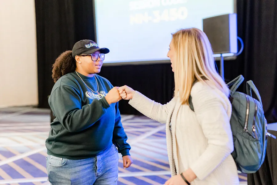 Dajae fist-bumping an educator after her session