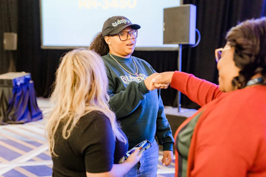 Dajae in conversation with educators after a session